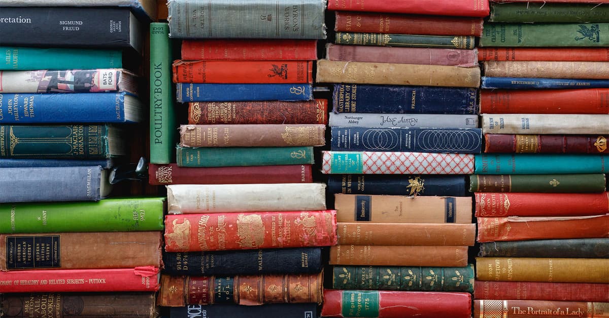 Colorful stacks of vintage hardcover books